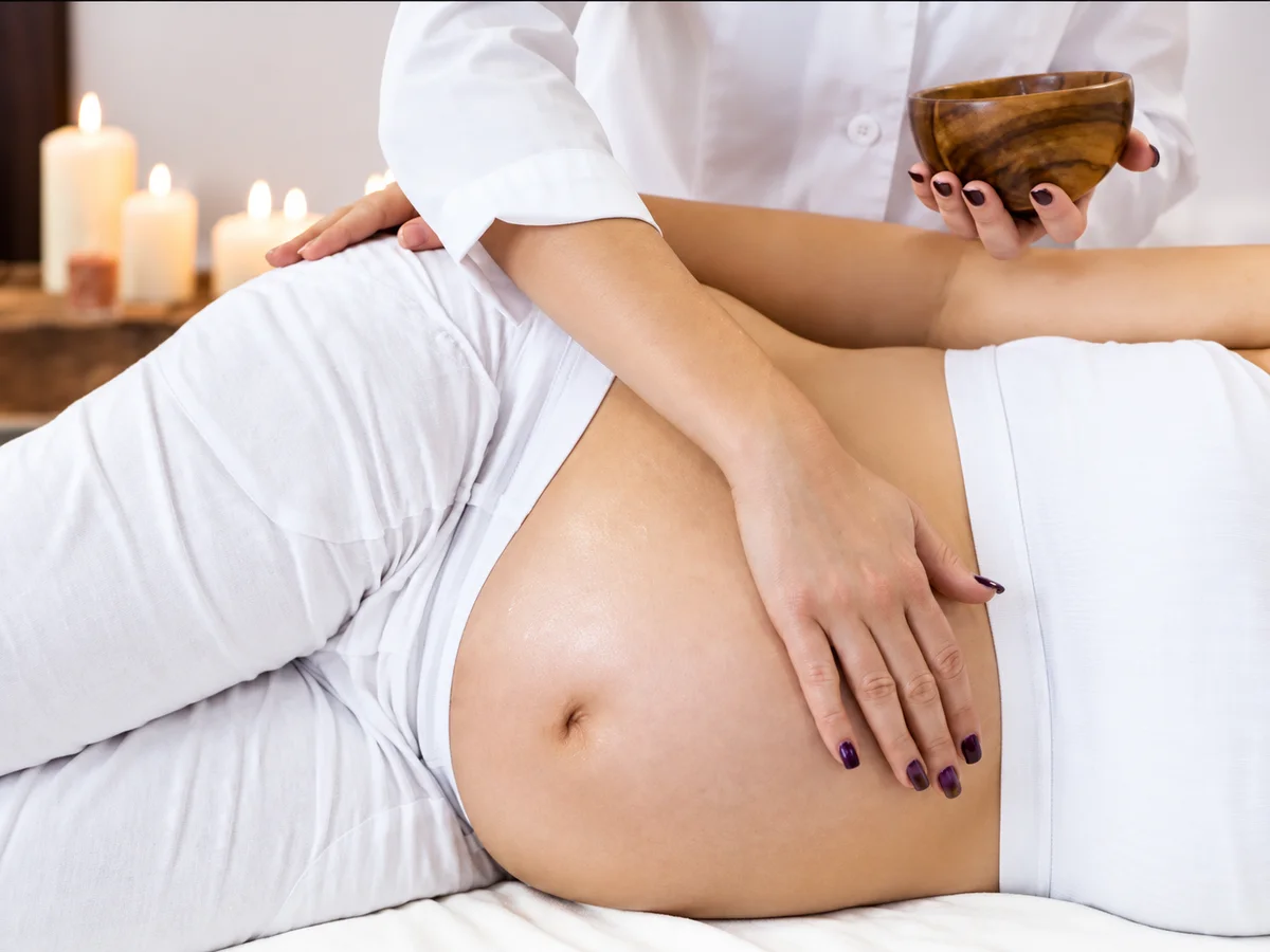 Prenatal massage with the client resting on her side